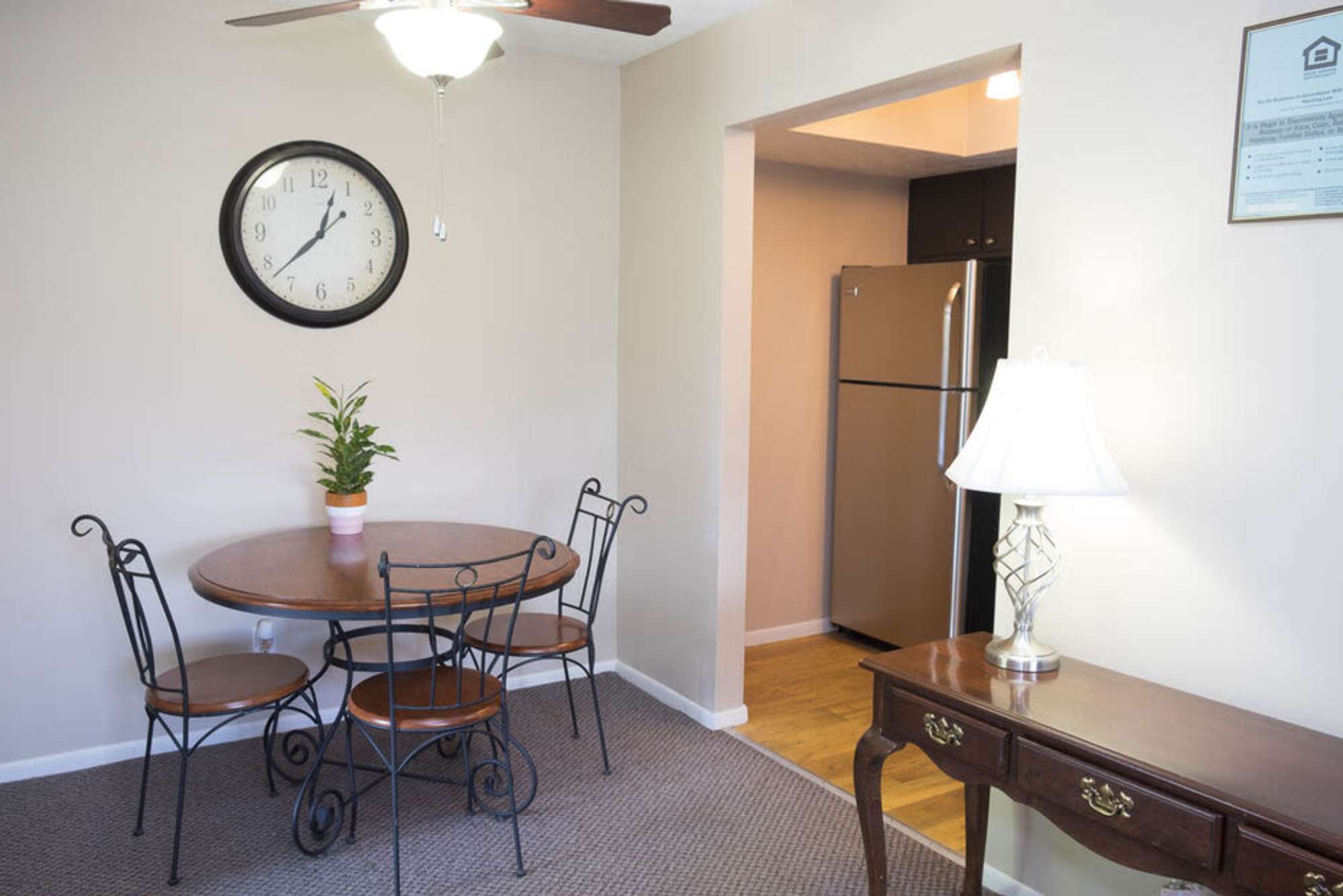 Village dining room with ceiling fan at Pointe at Northern Woods in Columbus, Ohio