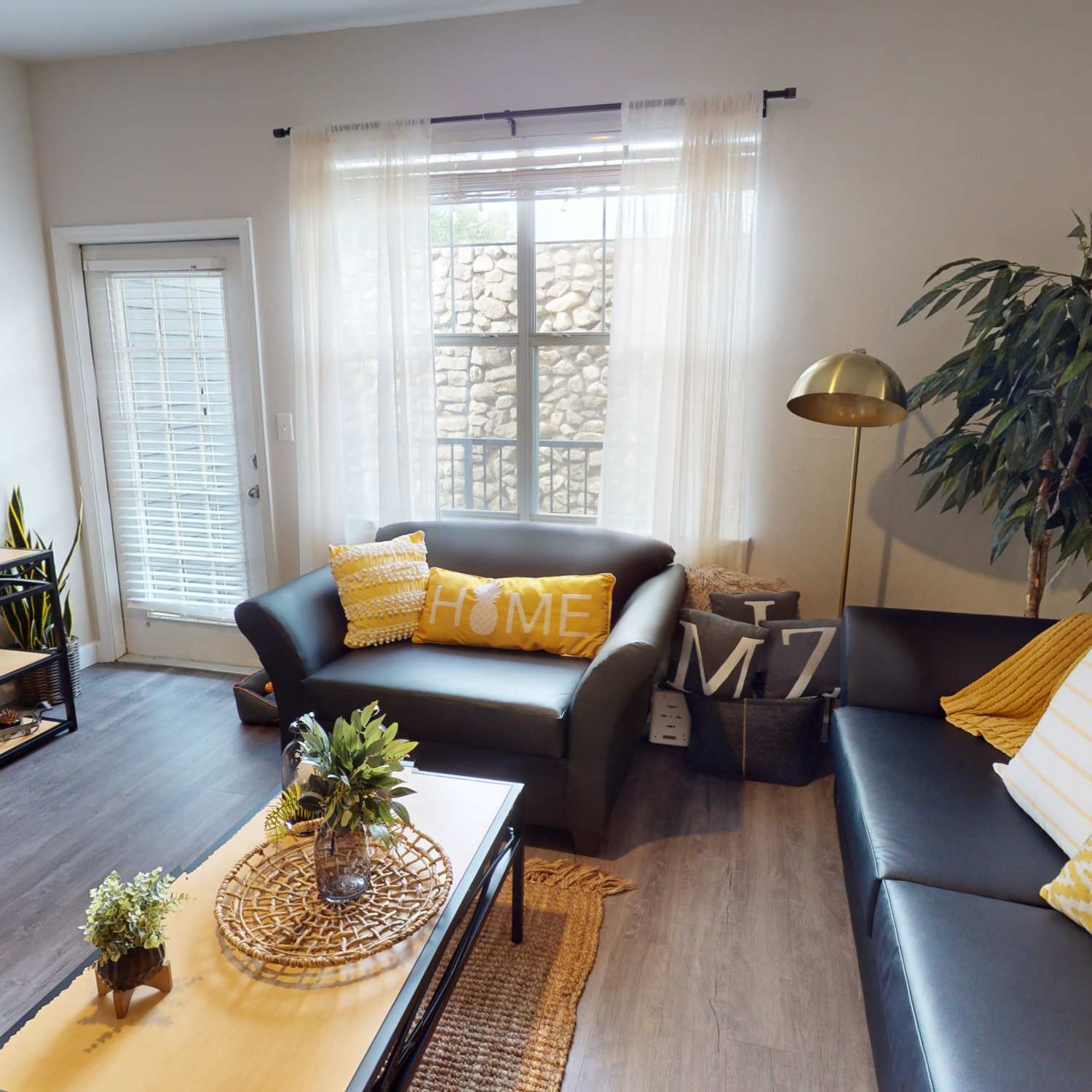 Living room with leather sofa at The Quarters Columbia in Columbia, Missouri
