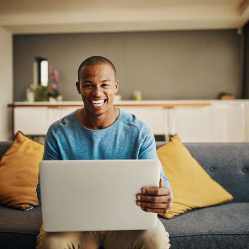 a resident on his laptop at Riverview Village in Indian Head, Maryland
