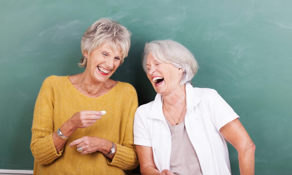 Two friends enjoying laughs at Keystone Place at Richland Creek in O'Fallon, Illinois