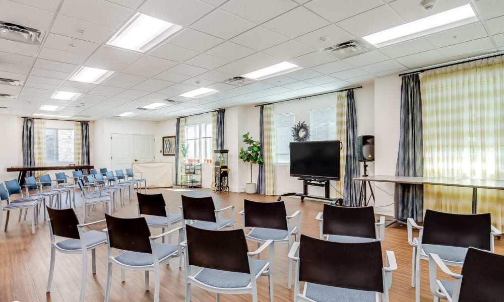 Community seating area with television at Pine Grove Crossing in Parker, Colorado