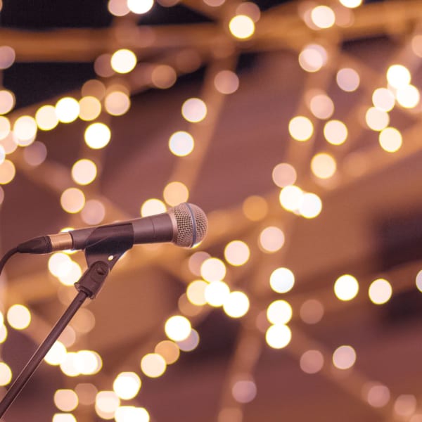 Mic with beautiful lighting in the background at ATX Fenton in Austin, Texas