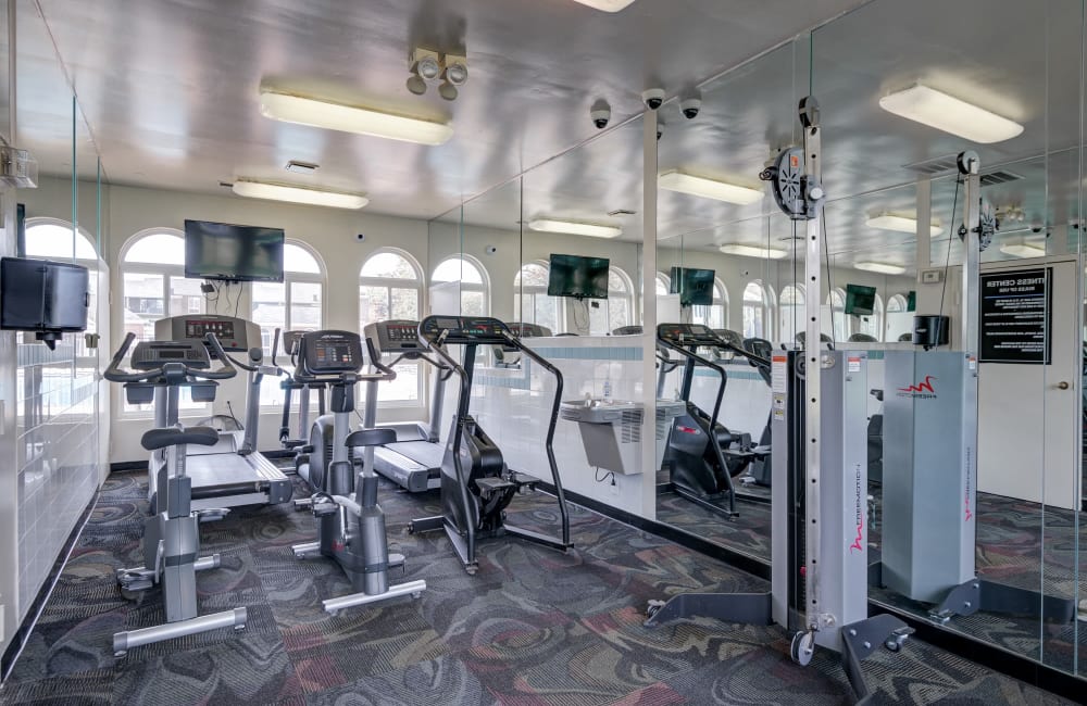 Well equipped fitness center at East Meadow Apartments in Fairfax, Virginia