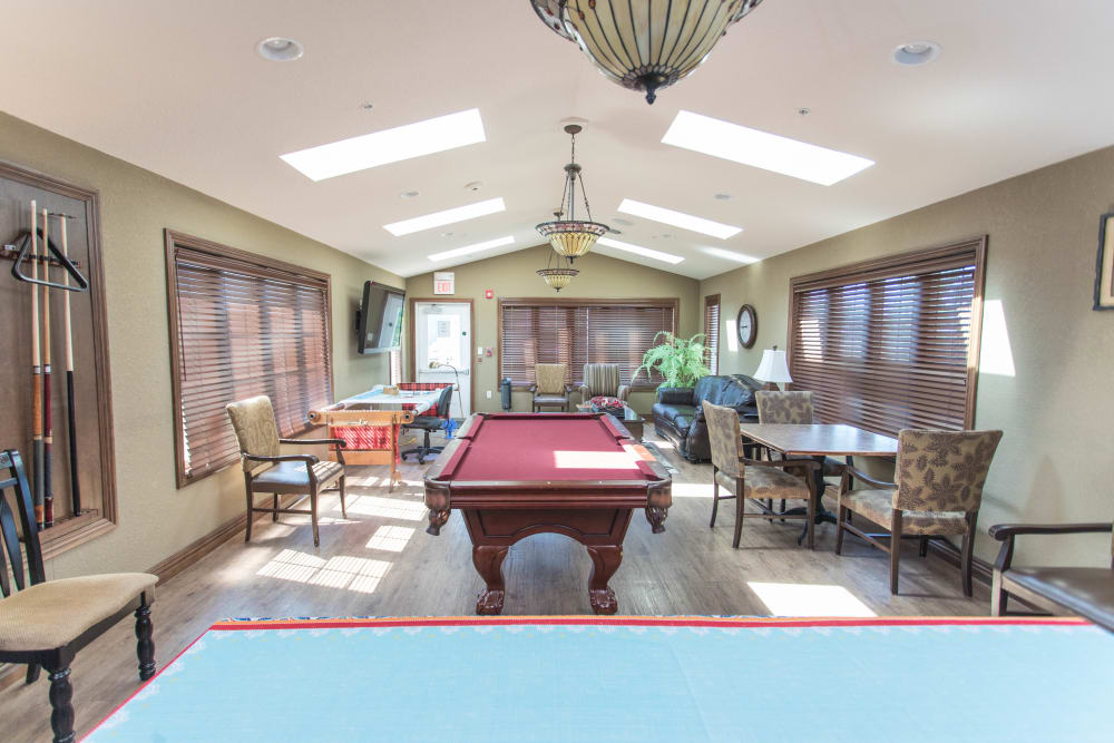 Clubhouse with a pool table in it at Villas of Holly Brook Newton in Newton, Illinois