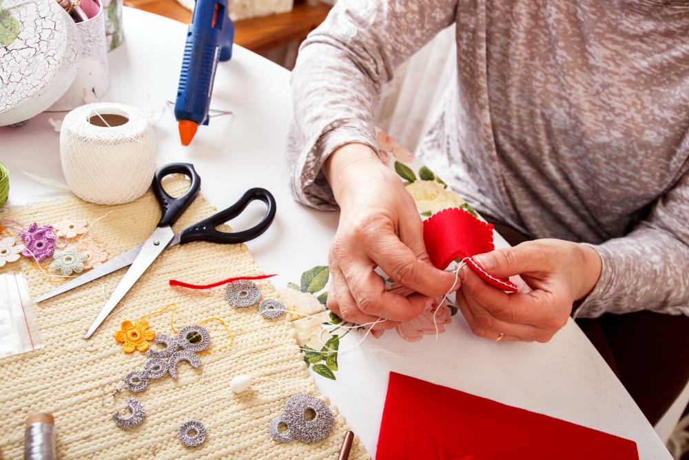 A resident doing crafts at a Randall Residence community