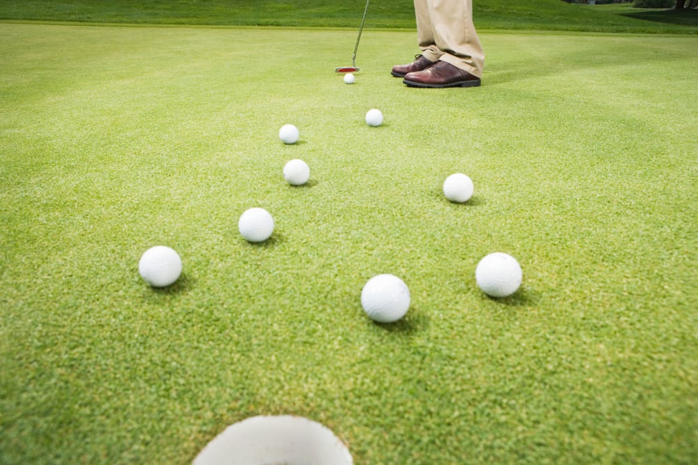 Resident playing golf near at Randall Residence