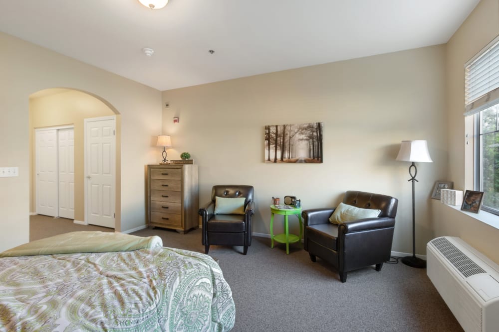 Well lit model bedroom at Claremont Place in Claremont, California