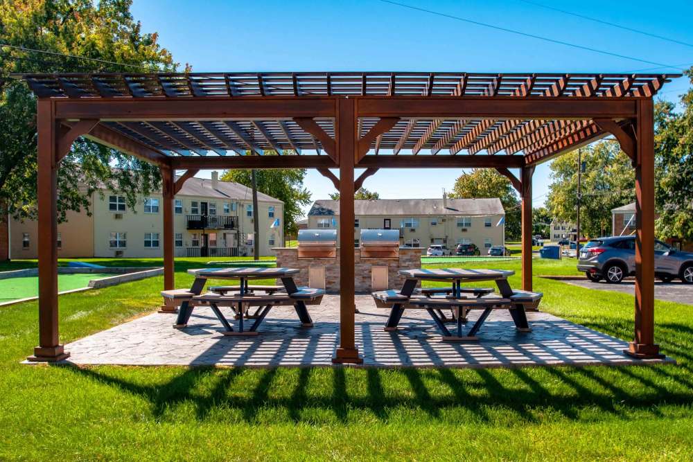 Exterior patio with gazebo and picnic tables at Camp Hill Plaza Apartment Homes