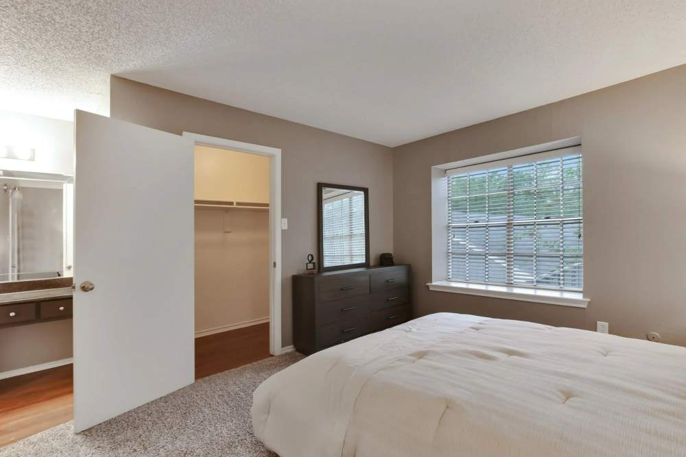 Walk-in closet inside the apartment bedroom at Parkwyn Townhomes in North Richland Hills,Texas