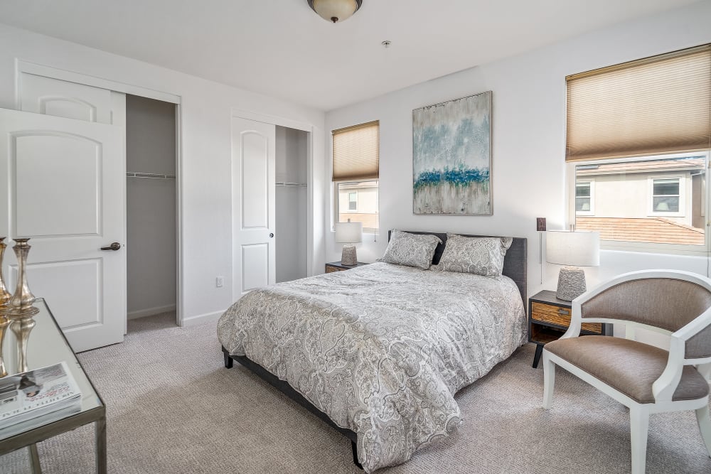 Primary bedroom with cozy bed at Ponté Palmero in Cameron Park, California