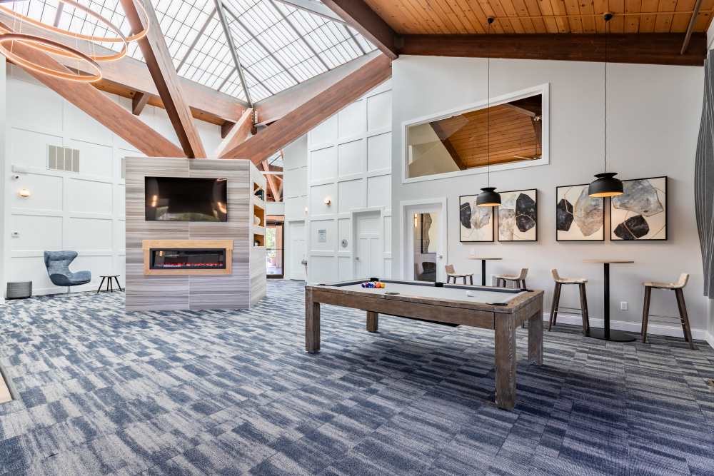 Clubhouse with fireplace and billiards at Regency Lakeside Apartment Homes