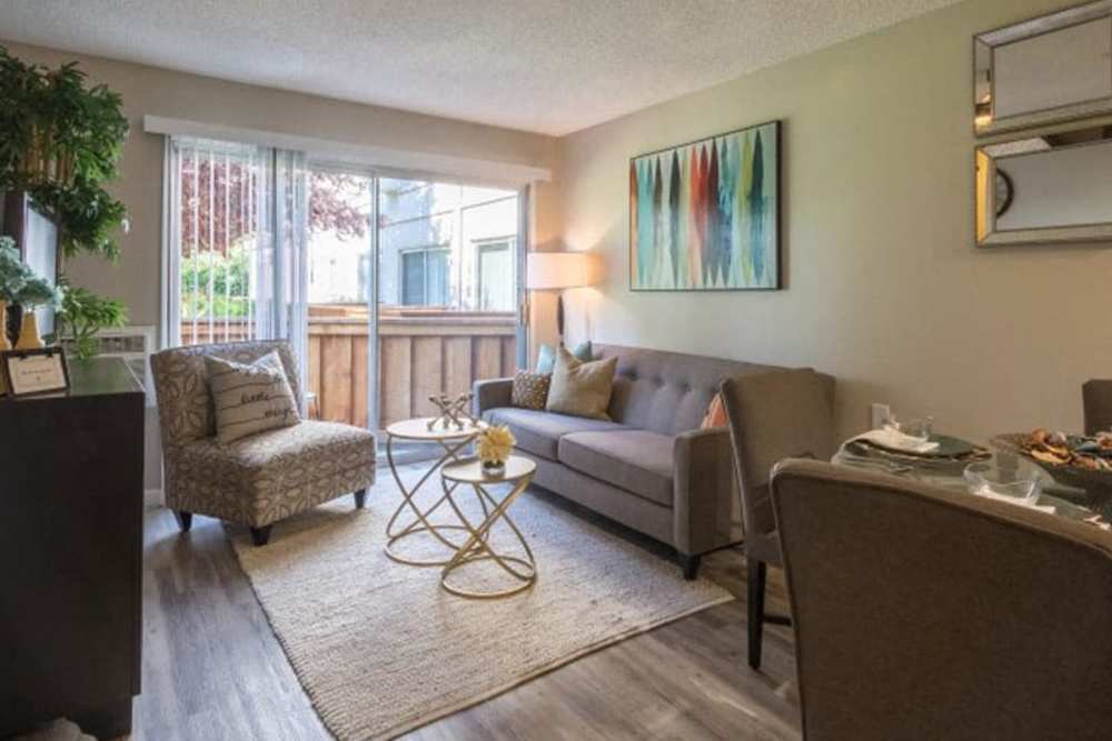 Living room with sliding door access to a private patio at Parc Station in Santa Rosa, California