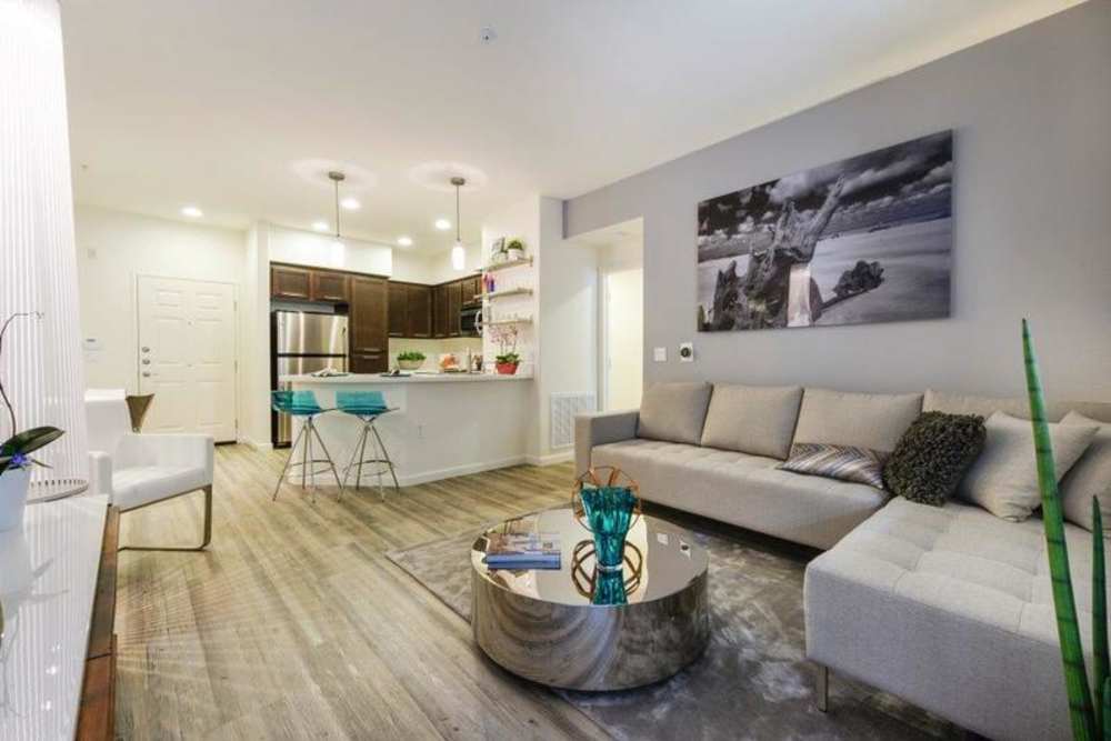 Living room with view of kitchen at Solterra in San Diego, California