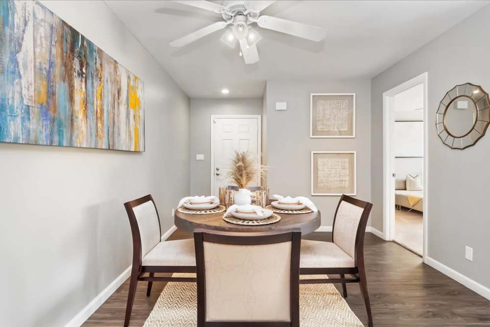 Dining area with ceiling fan at Mirabella Apartments in Bermuda Dunes, California