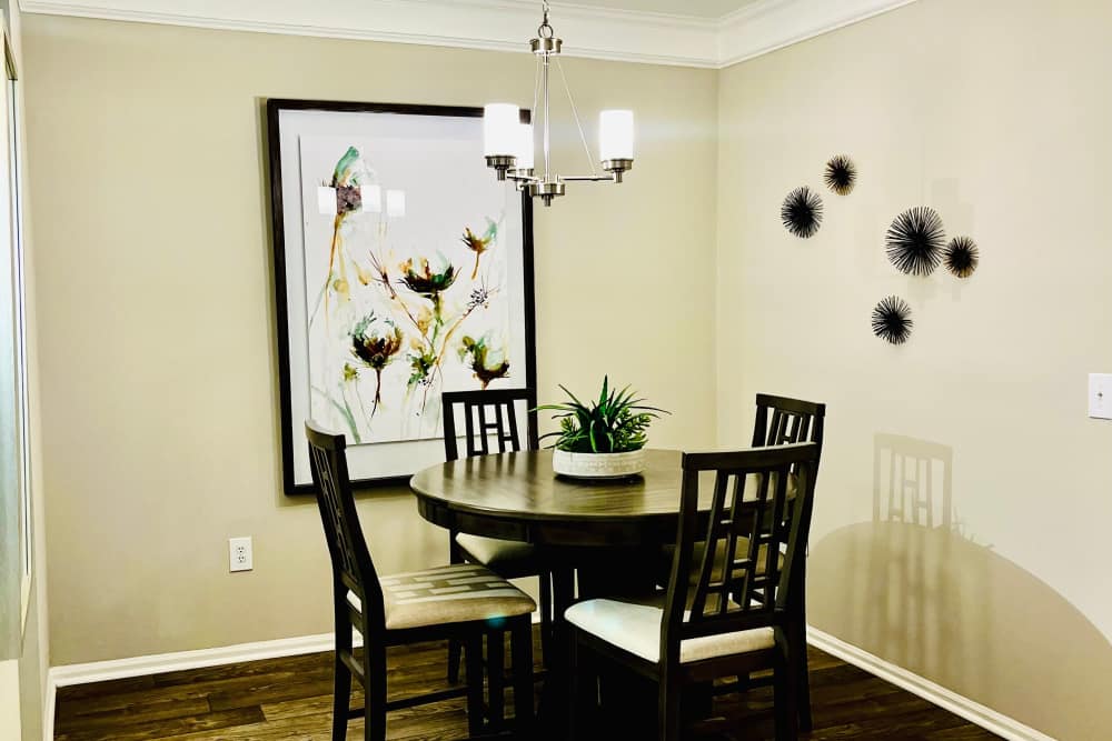 A dining table and chairs in a model apartment at Retreat at Johns Creek in Duluth, Georgia
