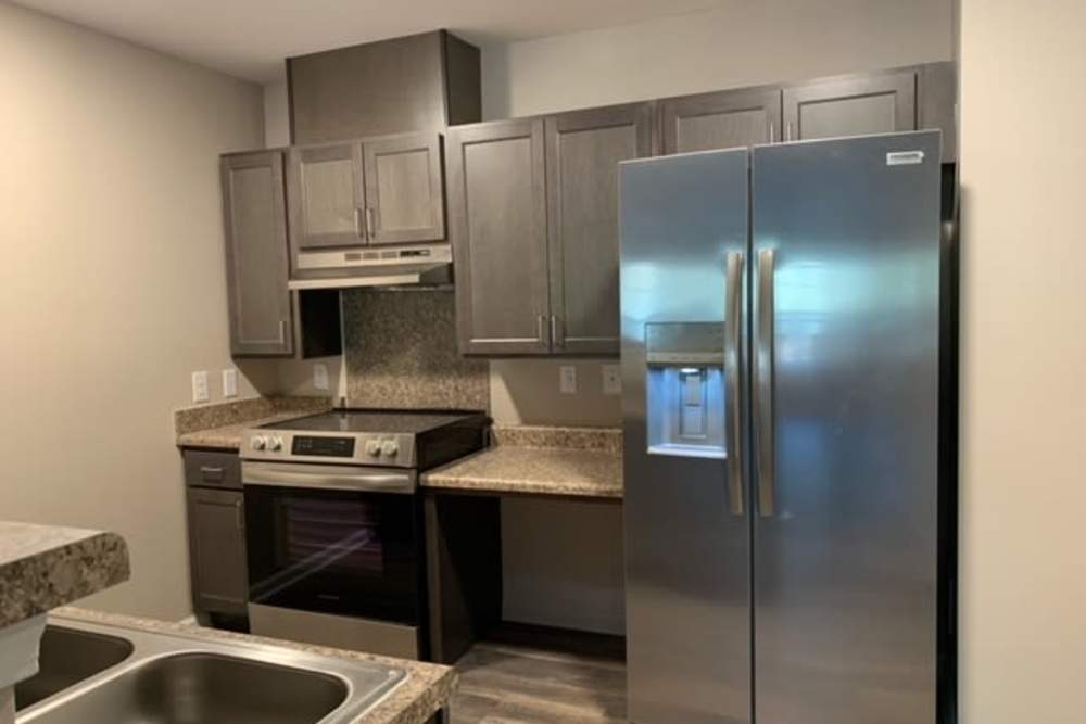 Stainless-steel appliances in a kitchen at Grande Oak Apartments in Williamsburg, Virginia