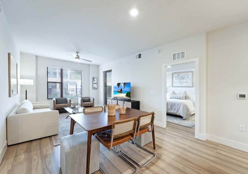 Stylish living room with television at Mark Lane Apartments in Naples, Florida