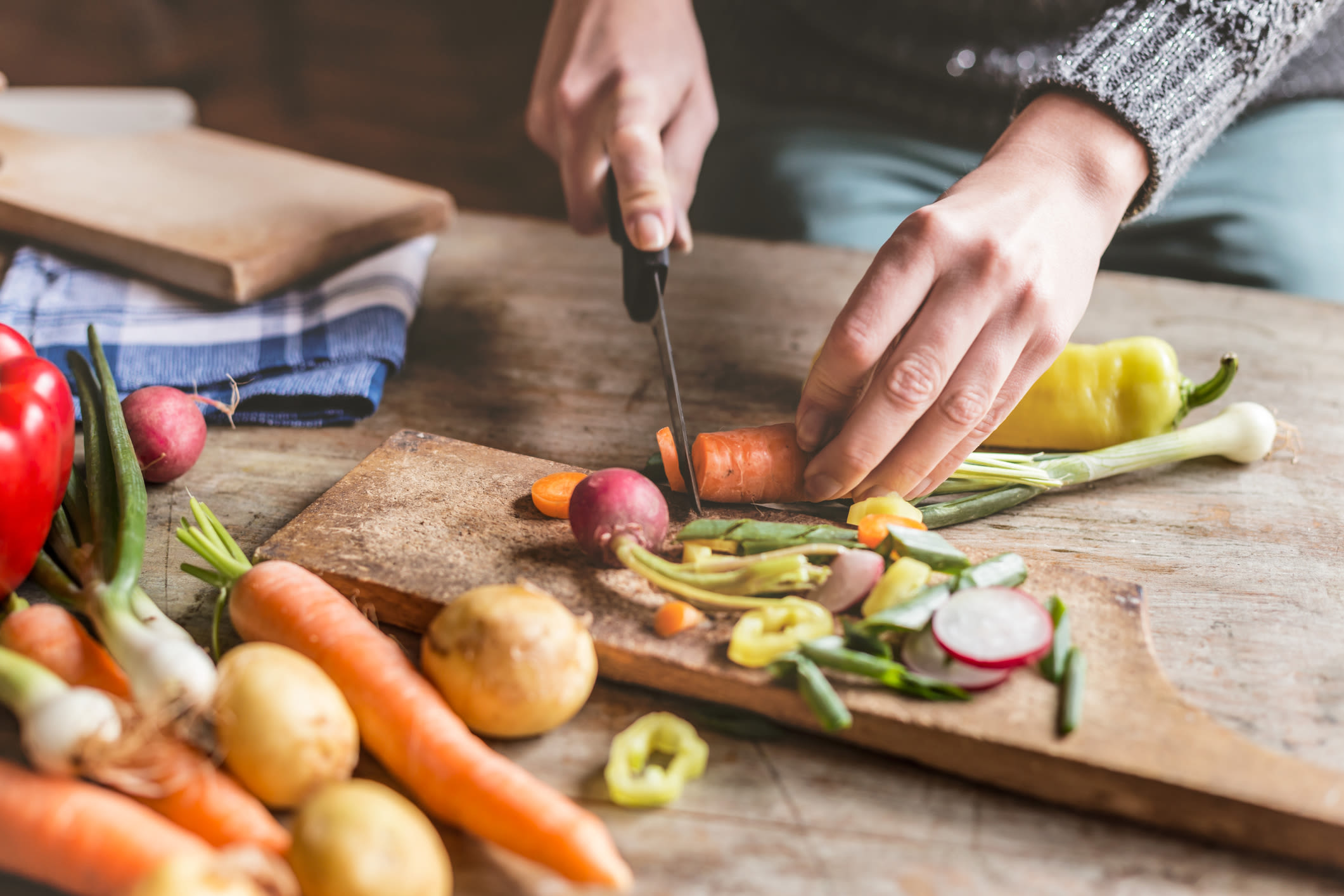 Resident preparing a meal in the kitchen of their new apartment at Holly Court in Pitman, New Jersey