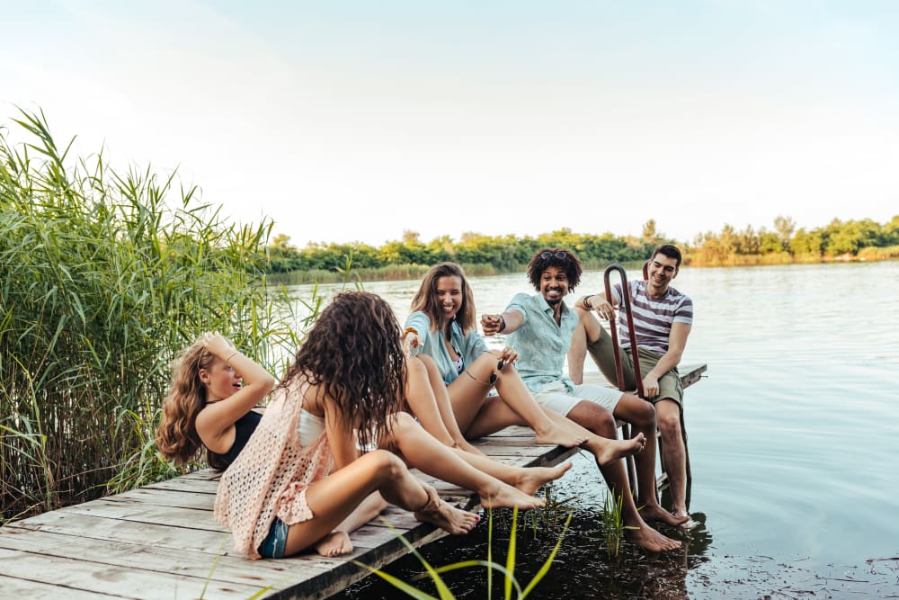 Residents relaxing on a dock near UNCOMMON Raleigh in Raleigh, North Carolina