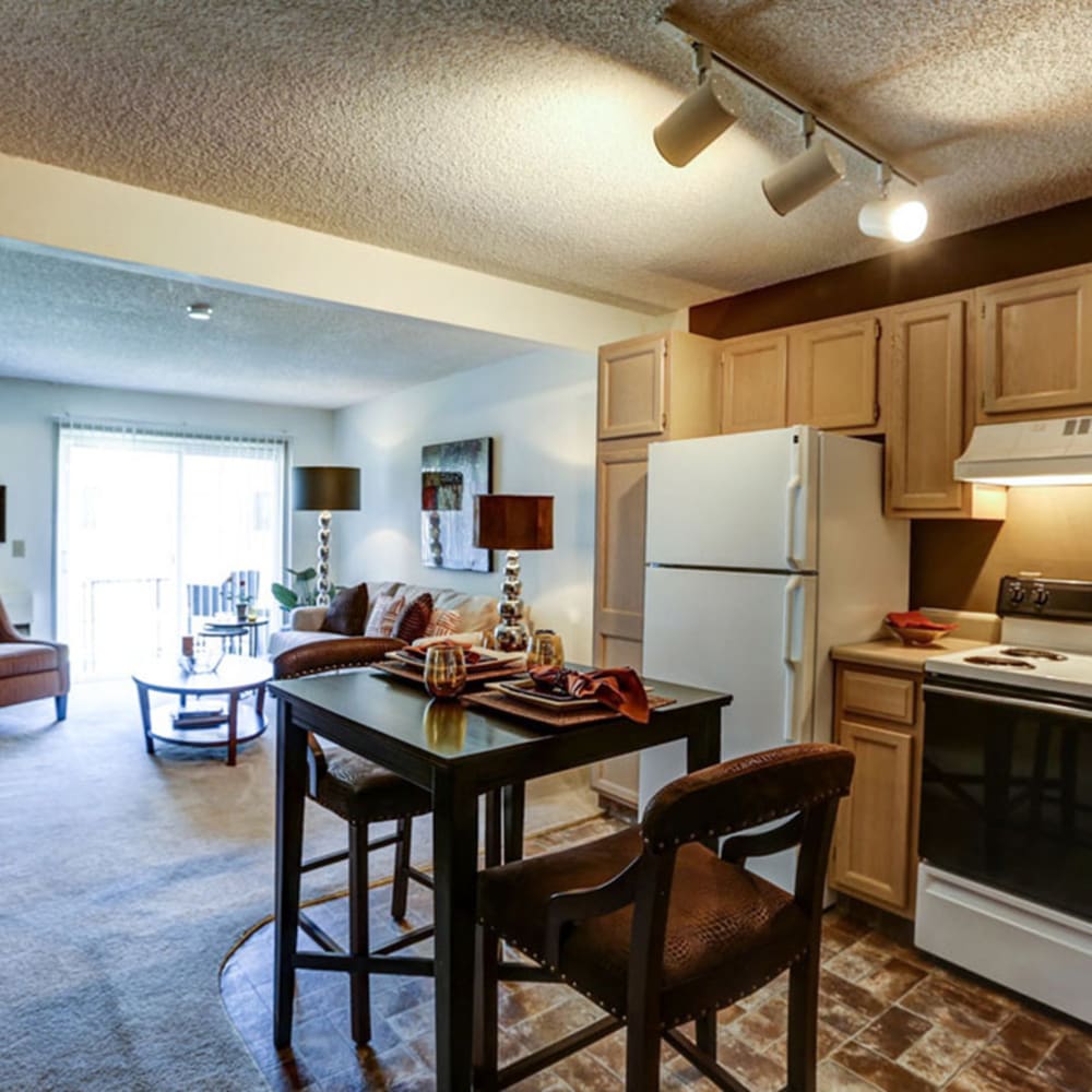 Model kitchen with dining area at The Falls in Mission, Kansas