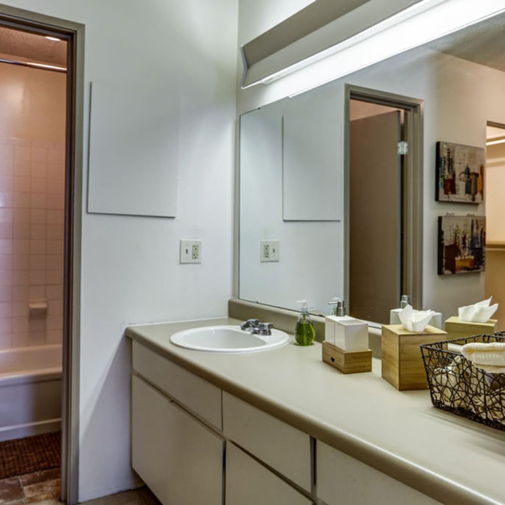 Model bathroom with large mirror at The Falls in Mission, Kansas