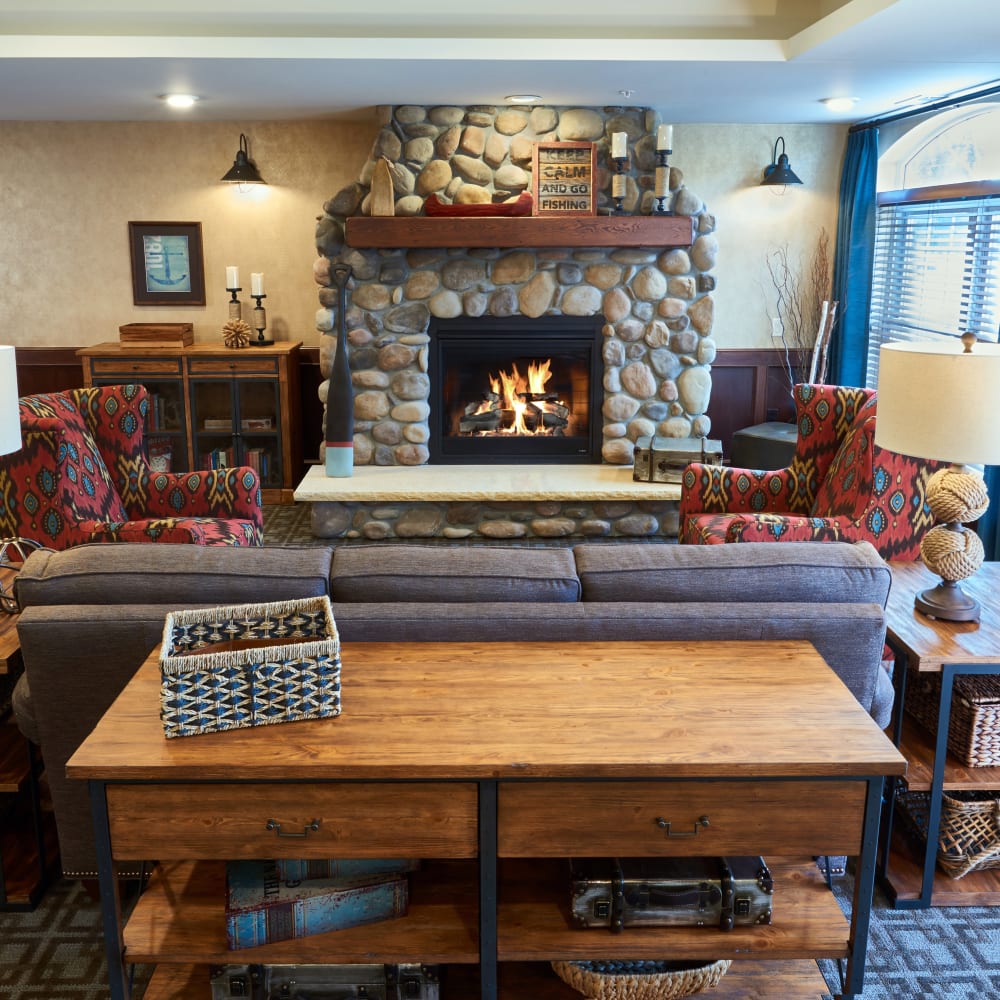 Lobby with a fireplace at Applewood Pointe of Champlin in Champlin, Minnesota. 