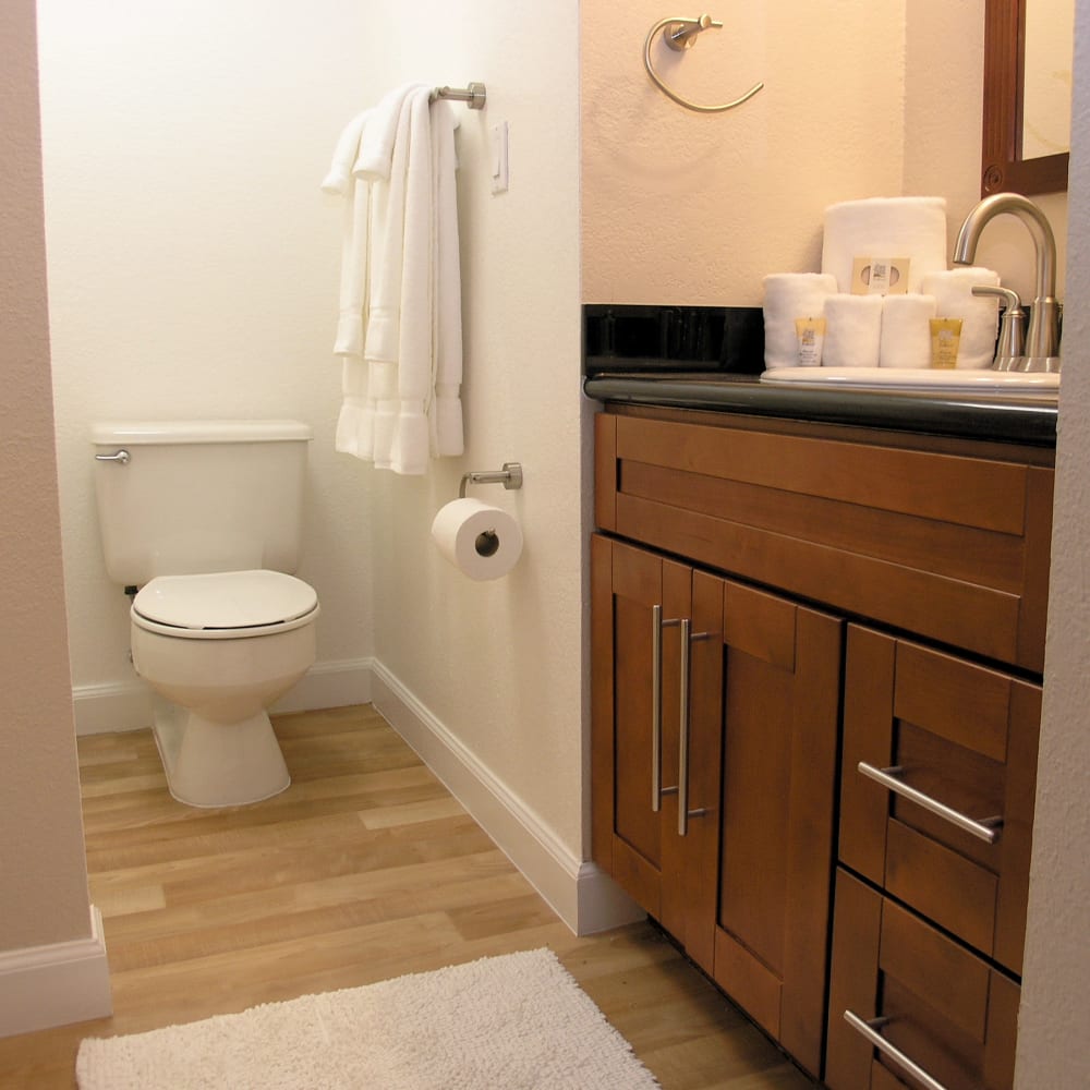 Bathroom with an oval tub and cabinet space in a standard apartment at Tower 737 Condominium Rentals in San Francisco, California