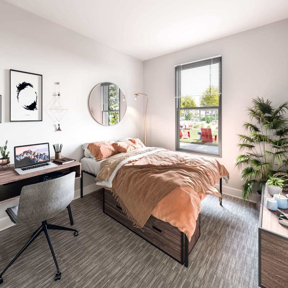 Well decorated bedroom at LATITUDE on Hillsborough in Raleigh, North Carolina