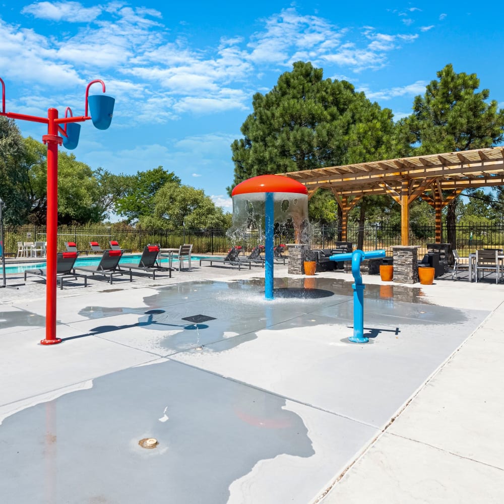 Sparkling pool with kids splash zone at Florida Station Apartments in Aurora, Colorado