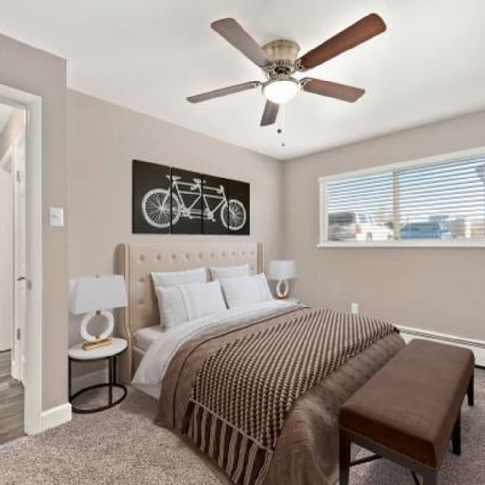 Spacious bedroom with large windows at The Phoenix in Brighton, Colorado