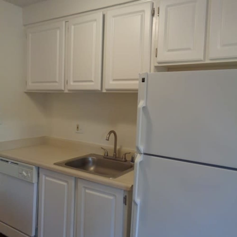 Sink and refrigerator in model apartment home at Amber Park in Sacramento, California