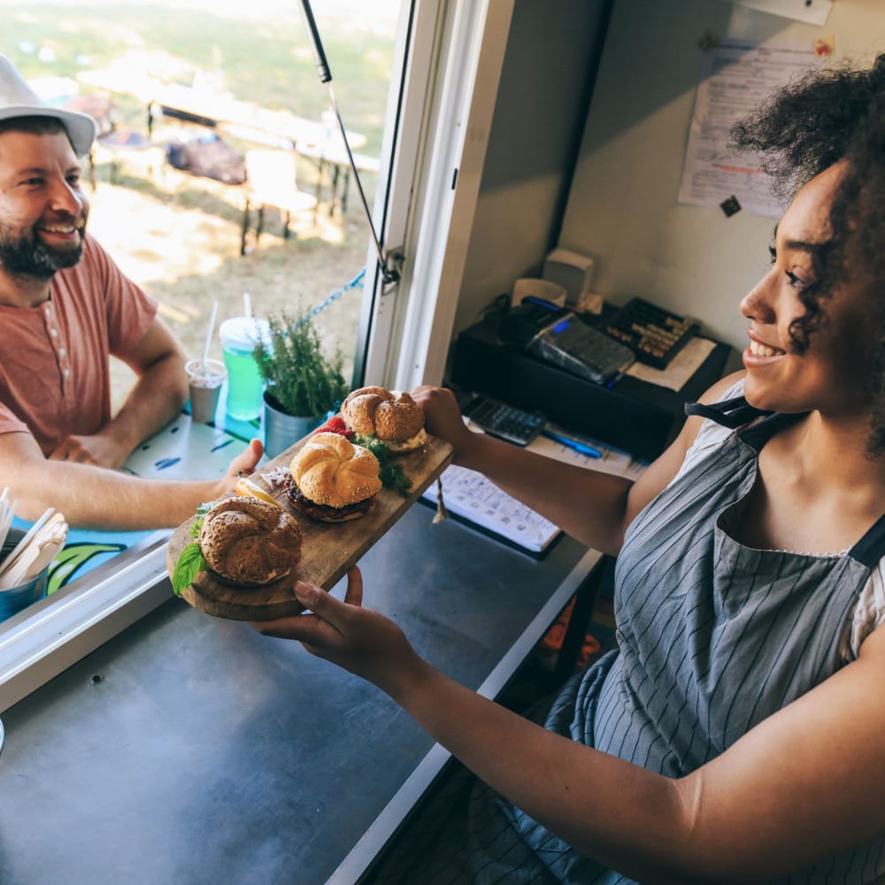 Resident buying food from a food truck near Solace on Peachtree in Atlanta, Georgia