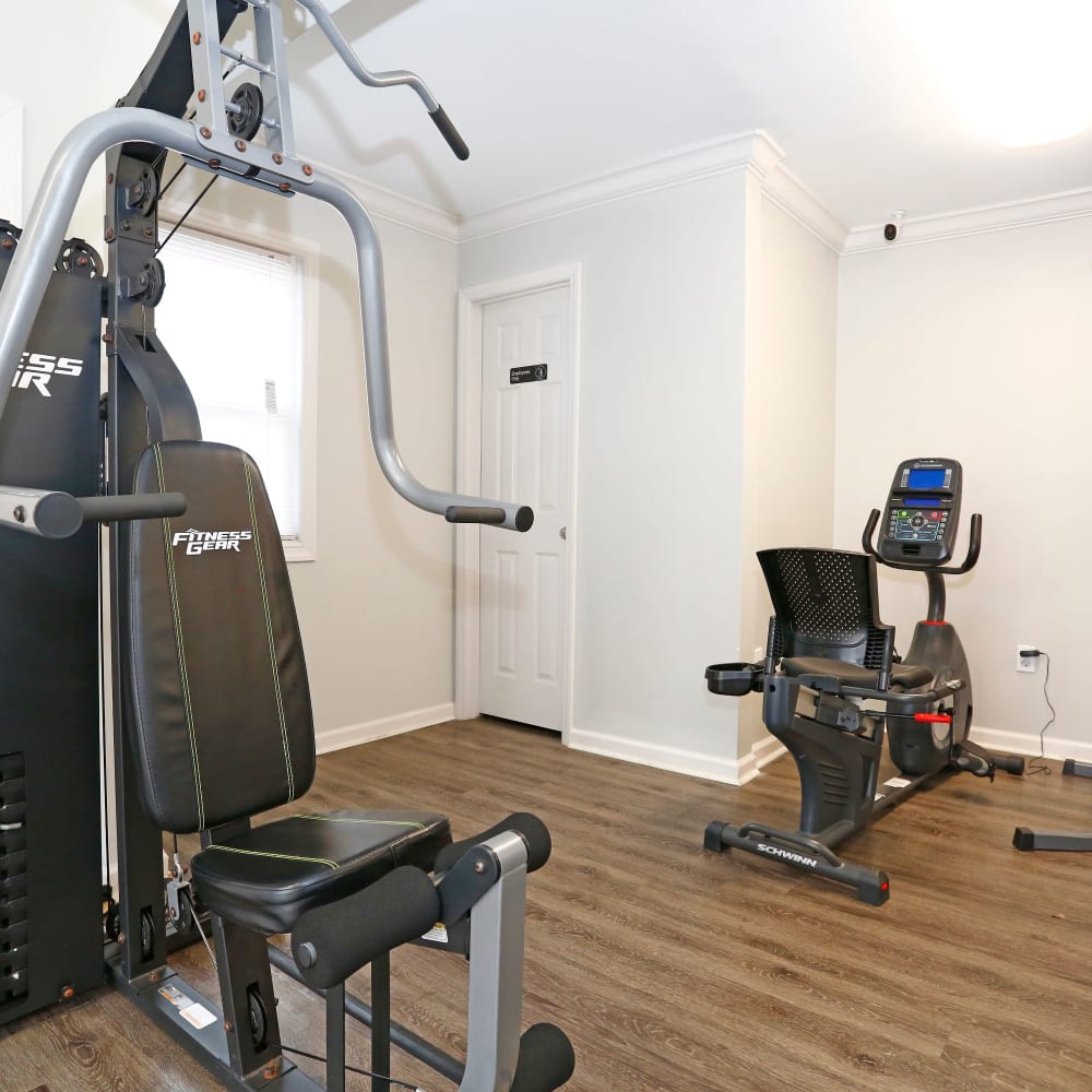 Weight machines in gym at Rippling Stream Townhomes in Durham, North Carolina