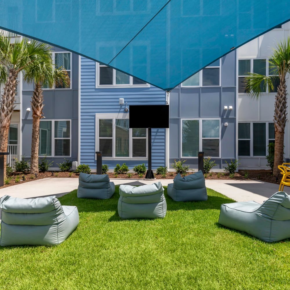 Courtyard with games for residents at UNCOMMON Wilmington in Wilmington, North Carolina