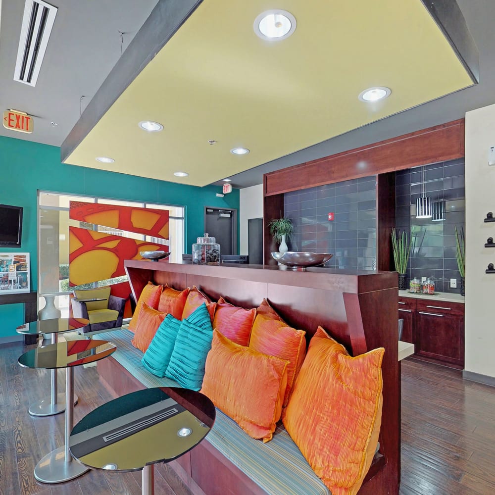 Colorfully decorated lobby at Oaks 5th Street Crossing at City Station in Garland, Texas