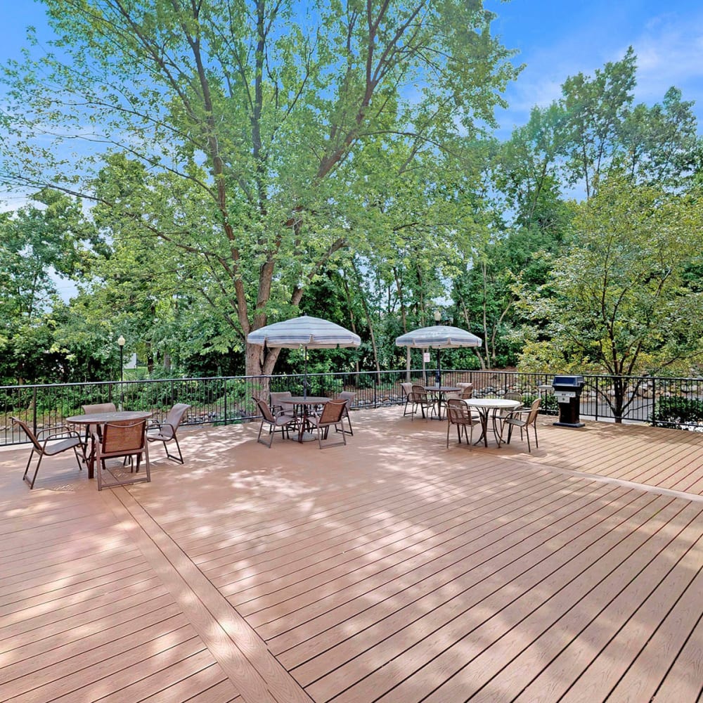 Expansive deck with shaded seating areas at Oaks Braemar in Edina, Minnesota