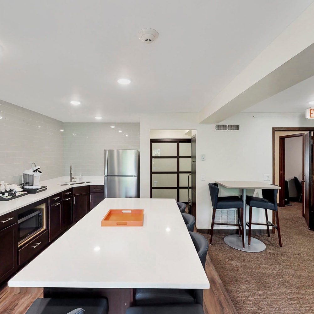 Bar seating at the demonstration kitchen in the resident clubhouse at Oaks Braemar in Edina, Minnesota