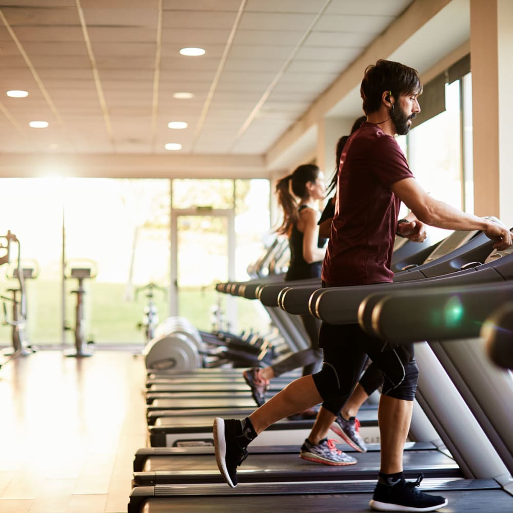 Residents staying in shape in the fitness center at Oaks Hackberry Creek in Las Colinas, Texas