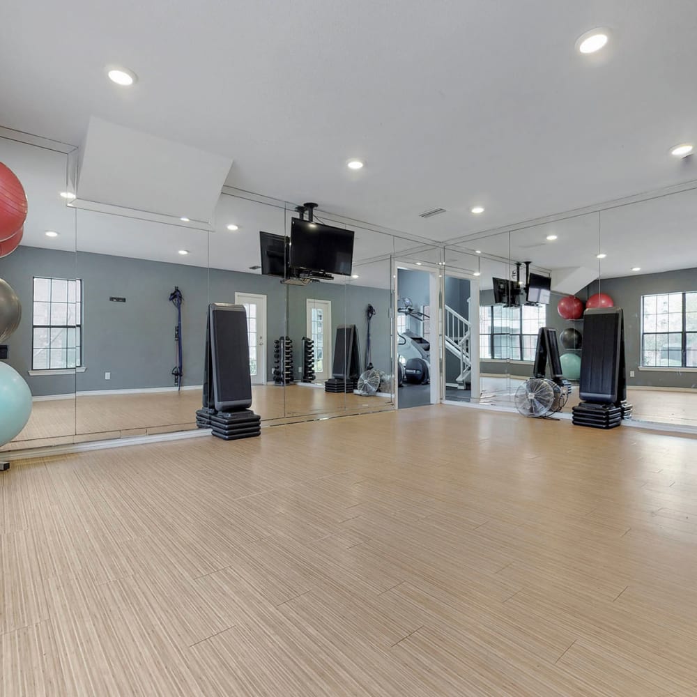 Spacious yoga area in the fitness center at Oaks Hackberry Creek in Las Colinas, Texas