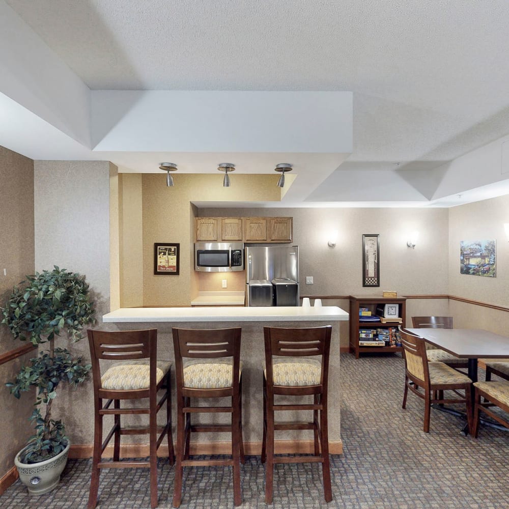 Bar seating at the demonstration kitchen in the clubhouse at Oaks Hiawatha Station in Minneapolis, Minnesota