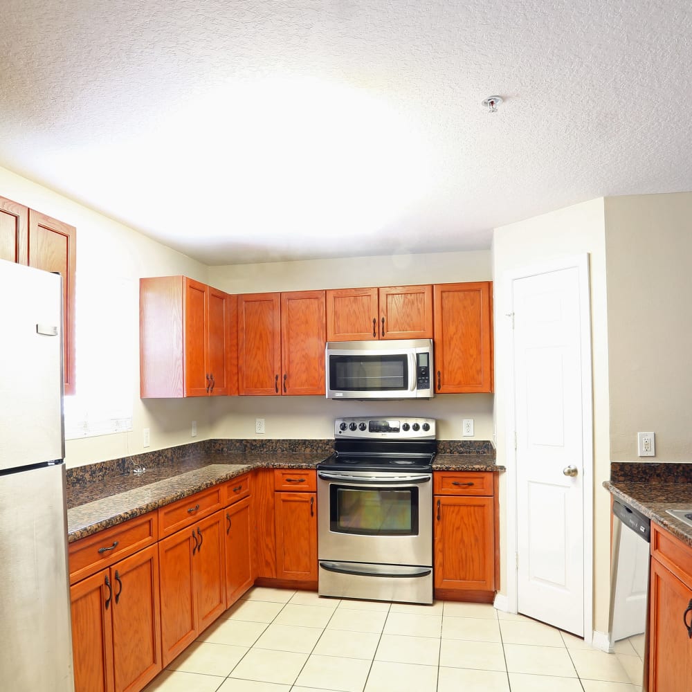 A large kitchen with plenty of cabinetry at Town Park Villas in Tampa, Florida