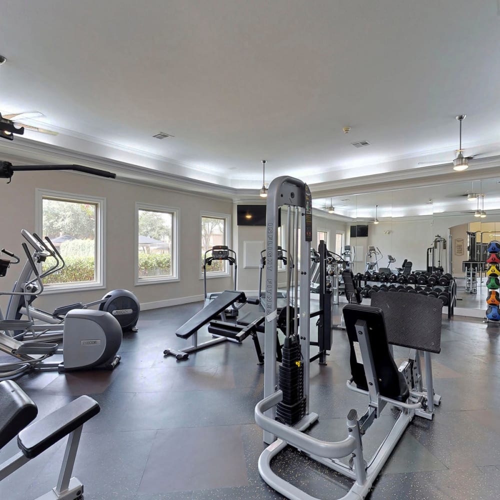 Well-equipped fitness center at Oaks Riverchase in Coppell, Texas