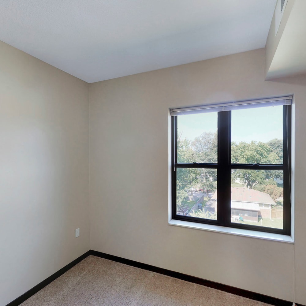 Bay window with terrific views from a model home's bedroom at Oaks Station Place in Minneapolis, Minnesota