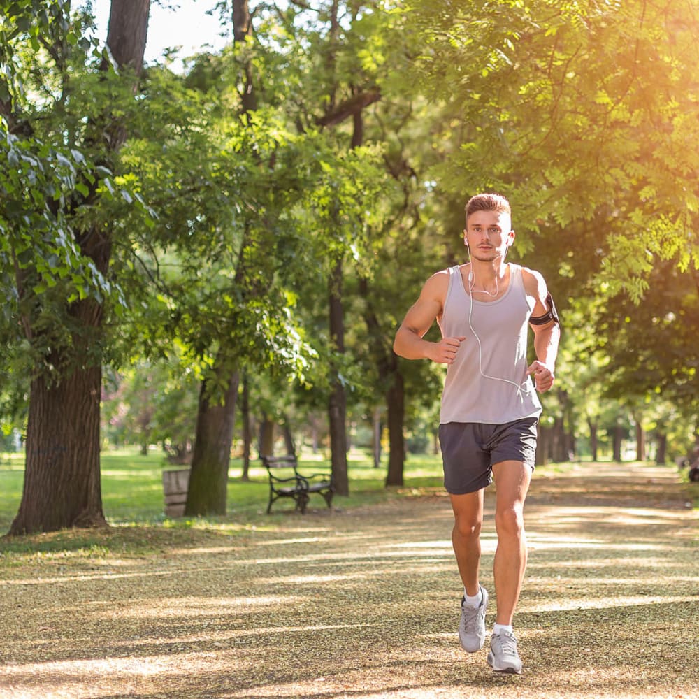 Resident out for a morning jog through a park near Oaks Trinity in Dallas, Texas