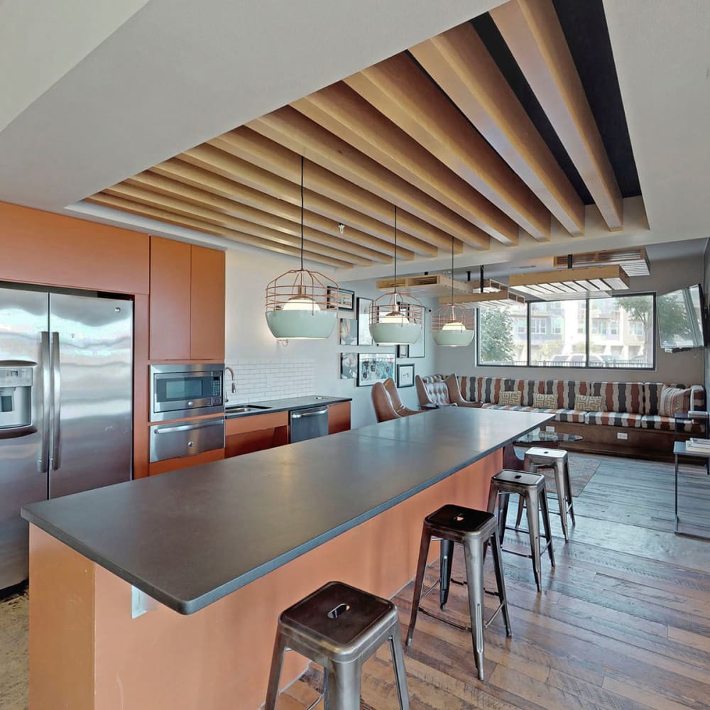 Demonstration kitchen with bar seating in the clubhouse at Oaks Trinity in Dallas, Texas