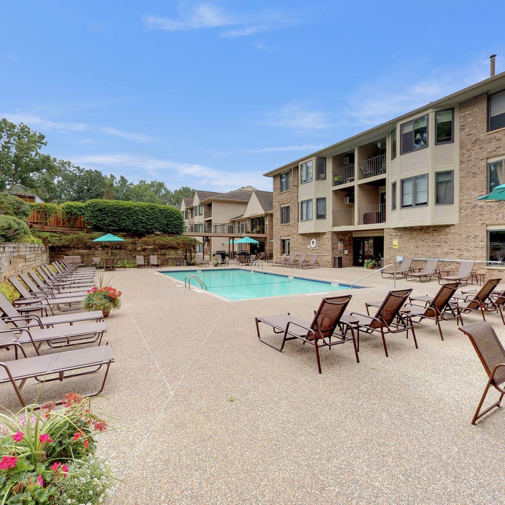 Chaise lounge chairs flanking the swimming pool at Oaks Vernon in Edina, Minnesota