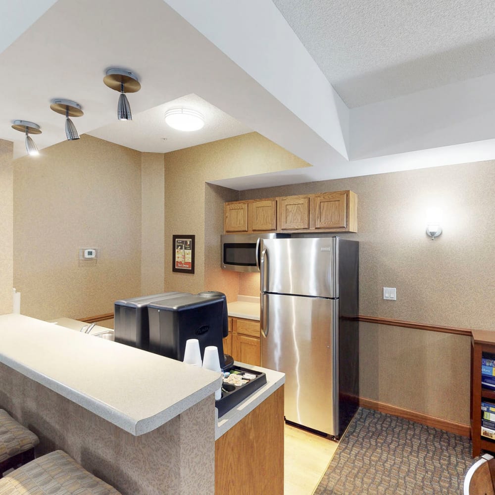 Kitchen with coffee station for resident enjoyment at Oaks Hiawatha Station in Minneapolis, Minnesota