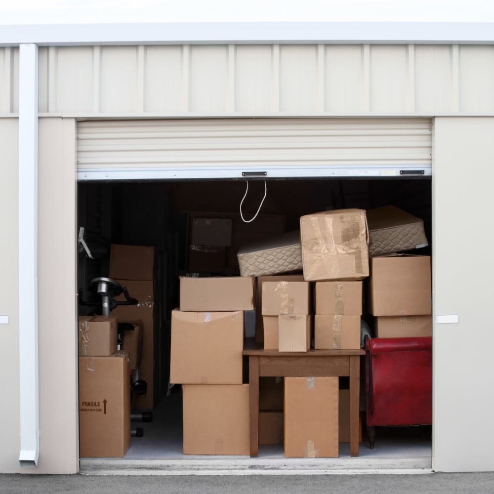 Moving boxes in a large storage unit ready to move at Legacy Management in Ft. Wright, Kentucky