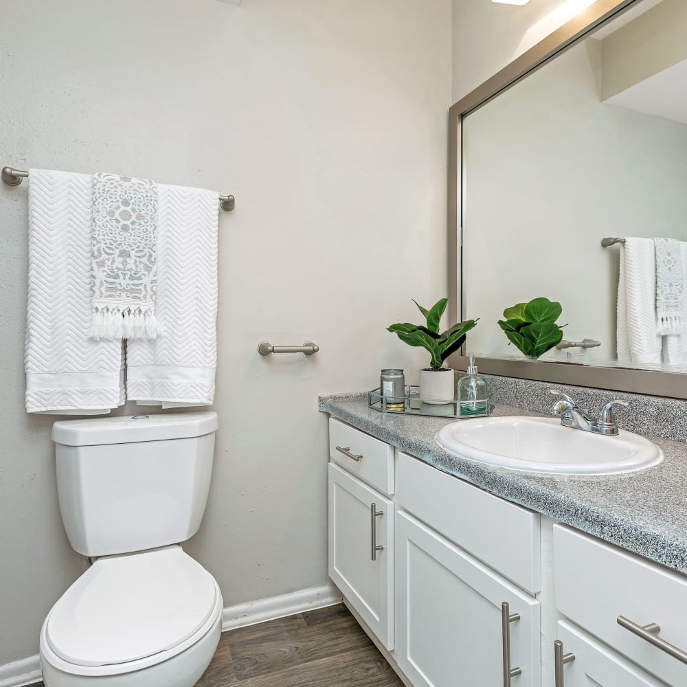 A spacious bathroom with a large vanity at Barringer Square in Webster, Texas