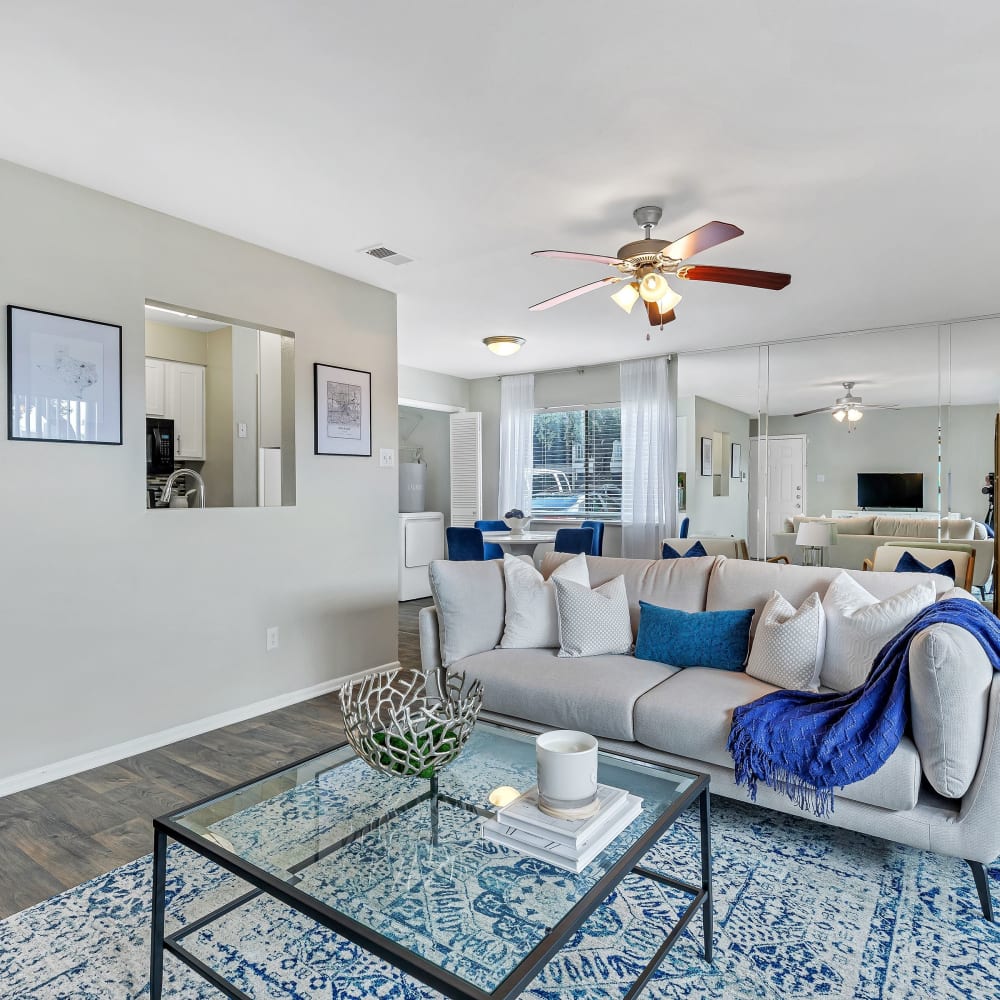 A spacious living with hardwood flooring at Barringer Square in Webster, Texas